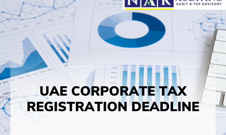 Business professionals reviewing tax documents for the UAE Corporate Tax Registration Deadline to ensure compliance and avoid penalties